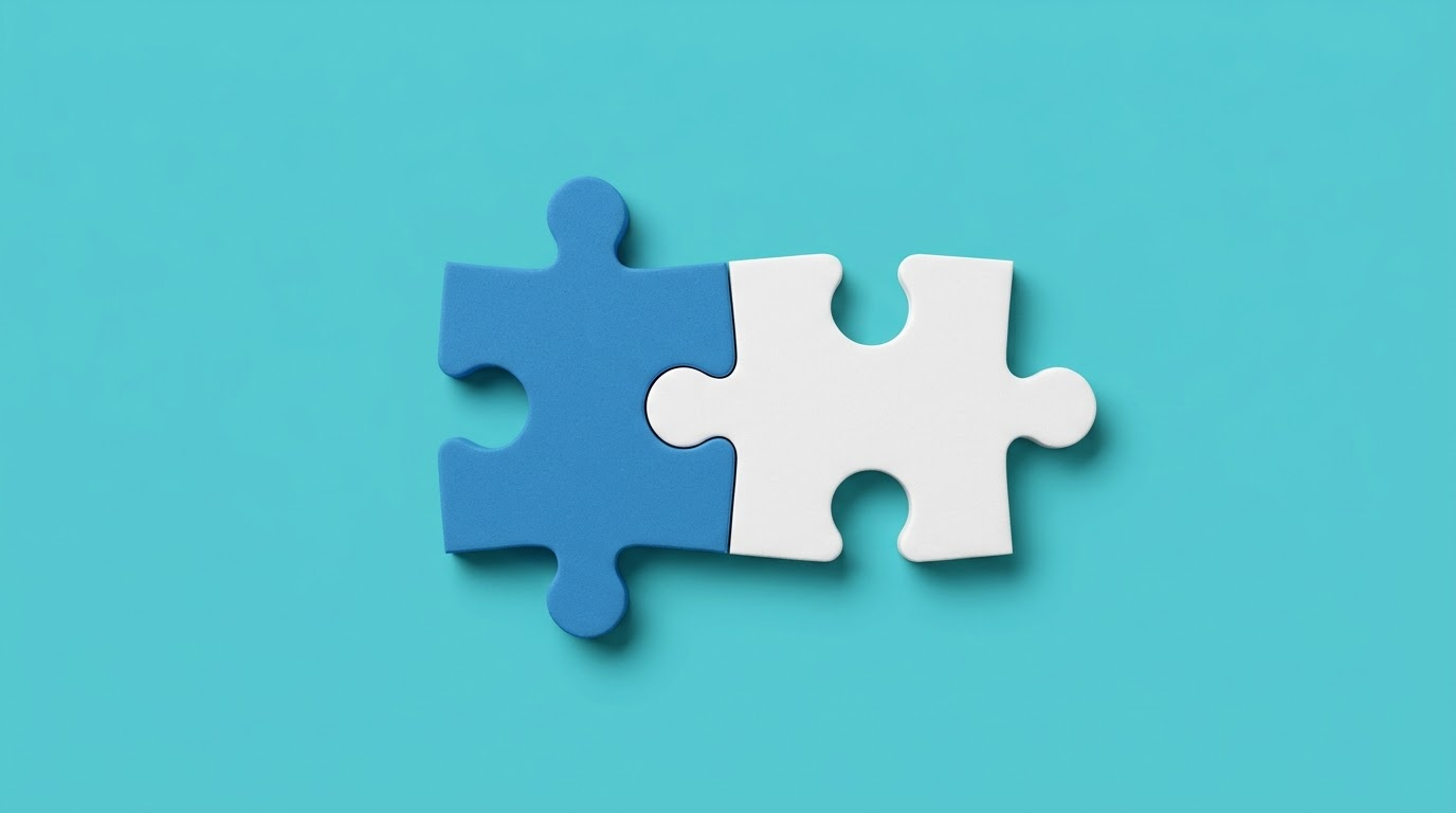 Two puzzle pieces joining, on a turquoise background