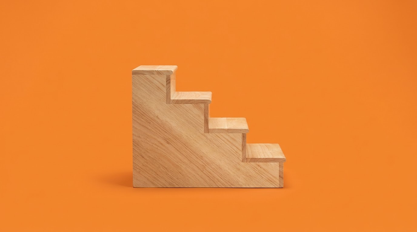 A small wooden staircase of four steps, on an orange background